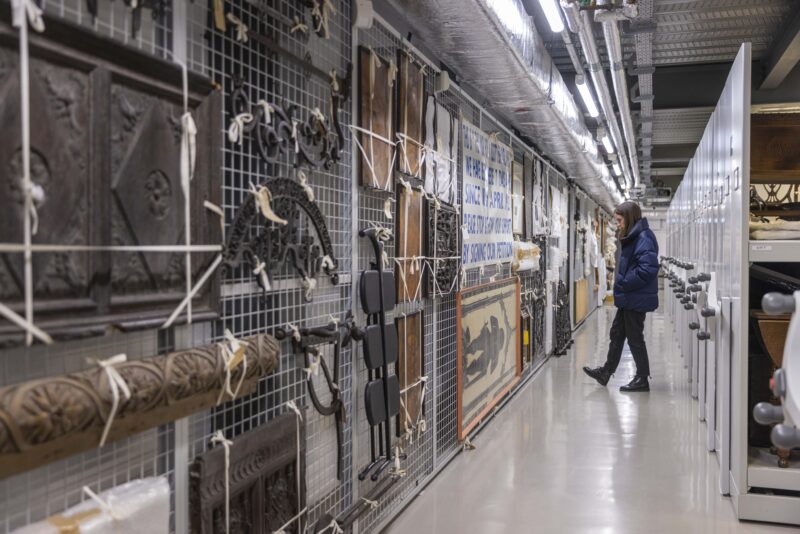 Image of the National Museum Collection Centre in Granton with artefacts hung on the wall