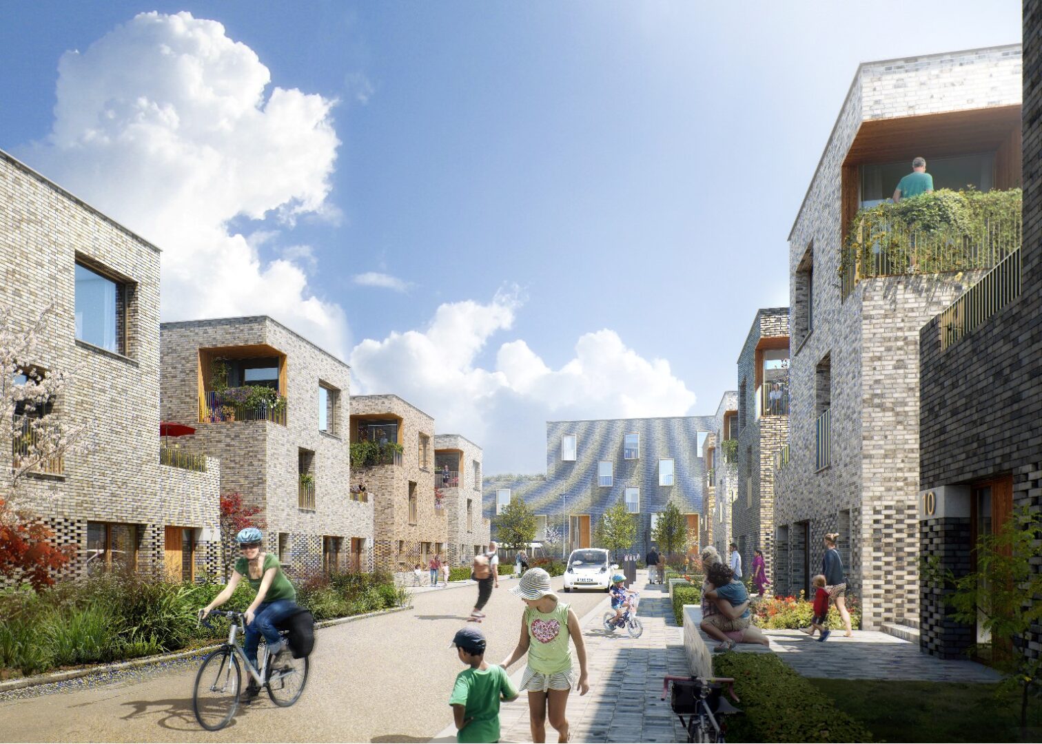 Illustrative visual of a street in Granton Waterfront once the development has complete, showing safe pedestrian routes and people walking with children and cycling.