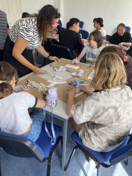 Image of adults participating in a workshops at Granton Hub