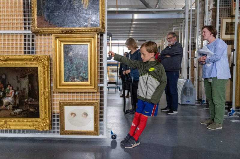 Young boy looking at art works in the National Galleries collection centre